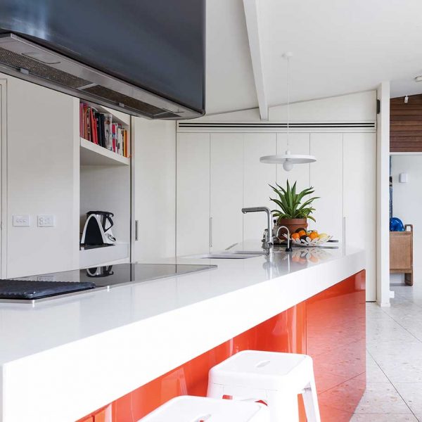 modern-white-laminex-kitchen-with-splash-of-orange (487530547)