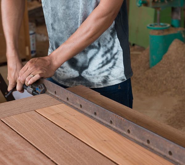 close-up-man-making-melamine-doors-in-workshop