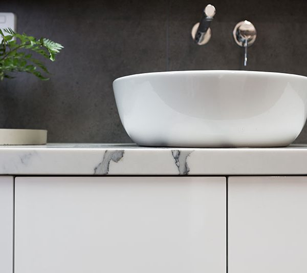 close-up-of-custom-bathroom-vanity-marble-top-white-basin