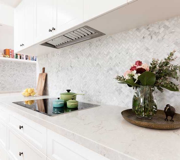 stone-benchtops-in-kitchen-with-homely-accessories